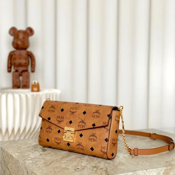 MCM Tan Monogram Clutch with Gold Accent - Picture 6 of 9